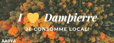 Slogan de l'asSociation I LOVE DAMPIERRE - JE CONSOMME LOCAL sur fond de forêt automnale